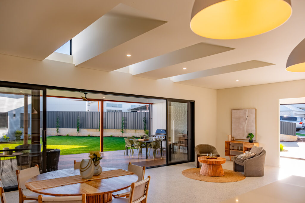 Open-plan living and dining area opening onto the backyard
